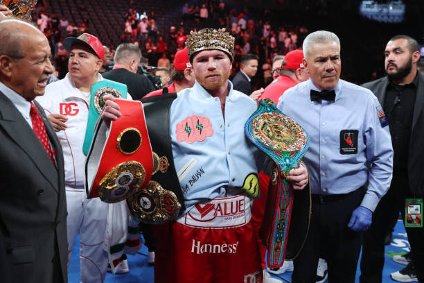Saul &quot;Canelo&quot; Alvarez poses with his championship belts after his unanimous decision victory against Gennadiy &quot;GGG&quot; Golovkin, in...