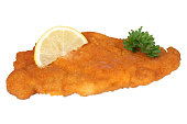 Schnitzel chop cutlet with lemon and parsley isolated