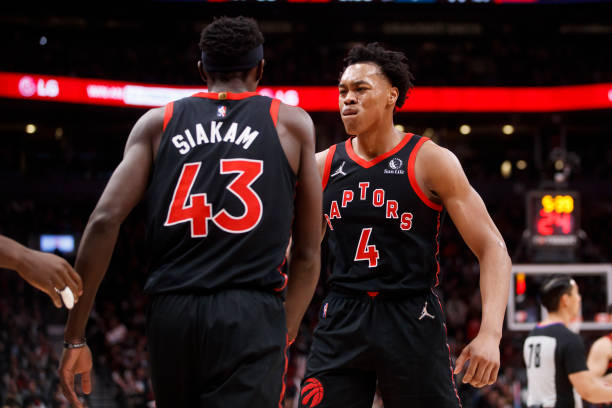 Scottie Barnes of the Toronto Raptors and Pascal Siakam celebrate during the first half of their NBA game against the Boston Celtics at Scotiabank...