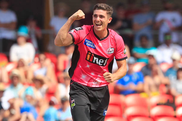 Sean Abbott of the Sixers celebrates the wicket of Brendon McCullum of the Heat during the Big Bash League match between the Brisbane Heat. He forms part of the Australia Cricket Squad.