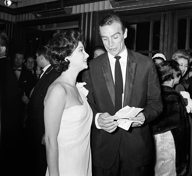 sean-connery-and-zena-marshal-attend-the-film-premiere-of-dr-no-james-picture-id592255702?k=6&m=592255702&s=612x612&w=0&h=H7OmBBfn9GMr7Cb8XJ-iMsw7JLHHHGQSYui1cQcPGK8=