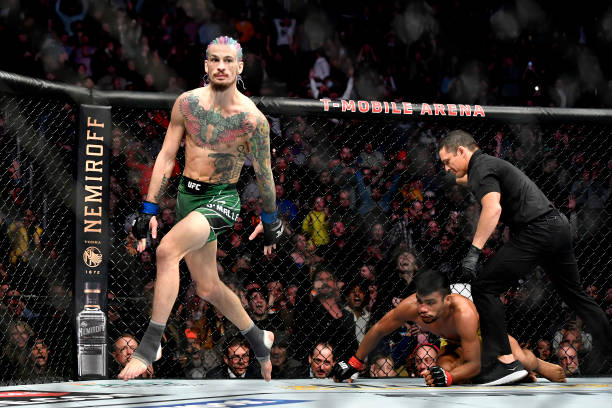 Sean O'Malley reacts after defeating Raulian Paiva of Brazil in their bantamweight bout during the UFC 269 on December 11, 2021 in Las Vegas, Nevada.