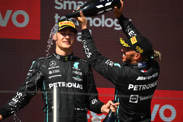Second placed Lewis Hamilton of Great Britain and Mercedes and Third placed George Russell of Great Britain and Mercedes celebrate on the podium...