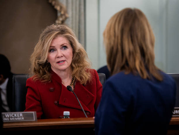 Sen. Marsha Blackburn talks with witness Mary Engle, right, before the Senate Commerce, Science, and Transportation Subcommittee on Consumer...