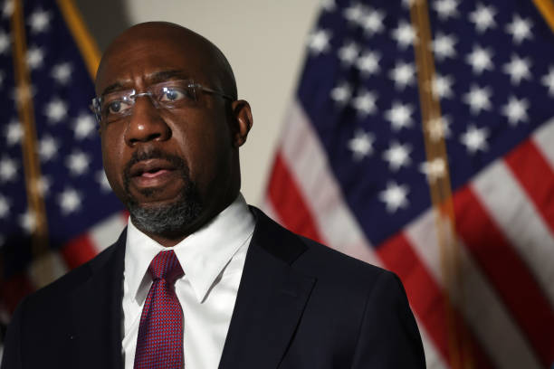 Sen. Raphael Warnock ) speaks to members of the press after a Senate Democratic Caucus meeting on January 18, 2022 in Washington, DC. Senate Majority...