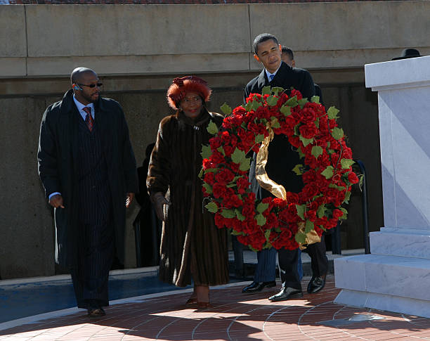Senator Barack Obama , carries a wreath to the grave of Martin Luther King with King's sister Christine Farris January 20, 2008 in Atlanta, Georgia....