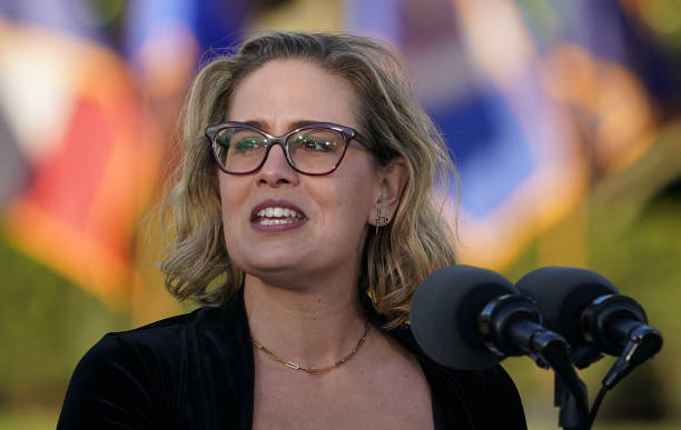 Senator Kyrsten Sinema speaks during a signing ceremony for H.R. 3684, the Infrastructure Investment and Jobs Act on the South Lawn of the White...