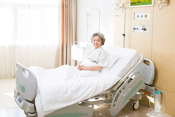 senior woman in hospital - asian old woman in bed stock pictures, royalty-free photos & images
