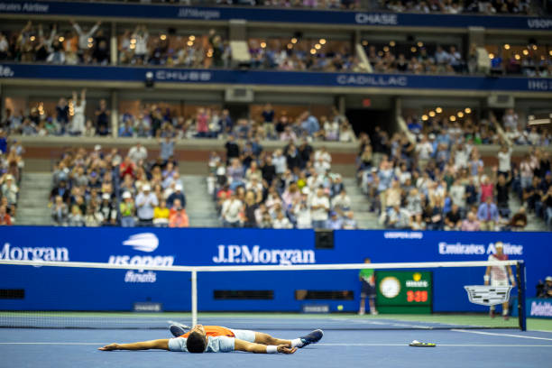 September 11: Carlos Alcaraz of Spain falls to the court as he celebrates his victory against Casper Rudd of Norway in the Men's Singles Final match...