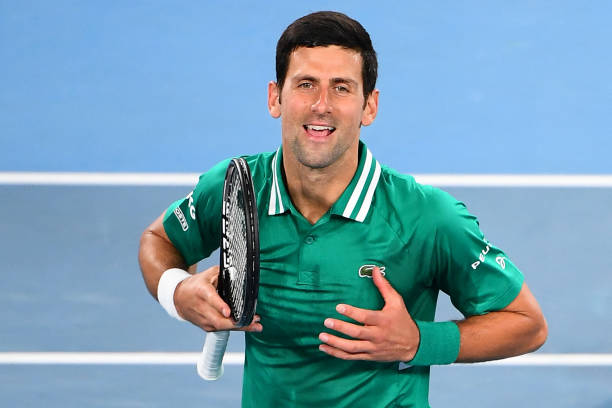 Serbia's Novak Djokovic celebrates beating France's Jeremy Chardy during their men's singles match on day one of the Australian Open tennis...