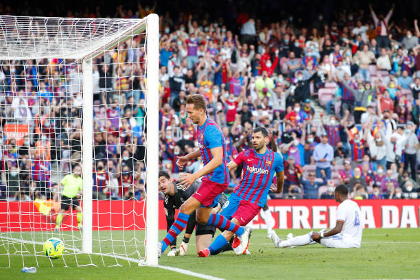 Sergio Aguero of FC Barcelona scores their side's first goal during the LaLiga Santander match between FC Barcelona and Real Madrid CF at Camp Nou on...