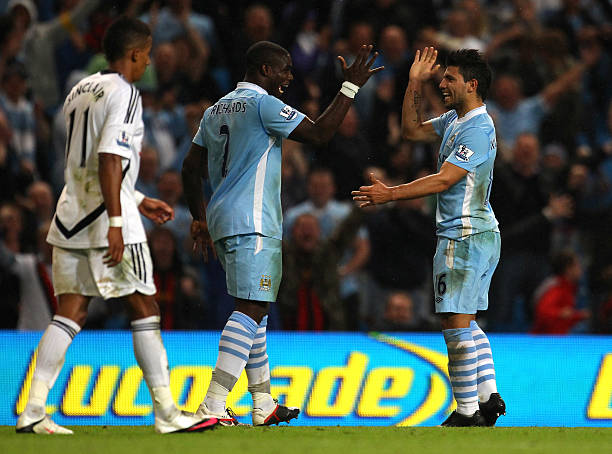Sergio Aguero of Manchester City celebrates with Micah Richards after scoring the fourth goal during the Barclays Premier League match between...