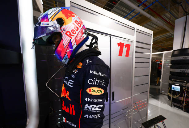 Sergio Perez of Mexico and Oracle Red Bull Racing weighs himself in the garage after final practice ahead of the F1 Grand Prix of Miami at the Miami...