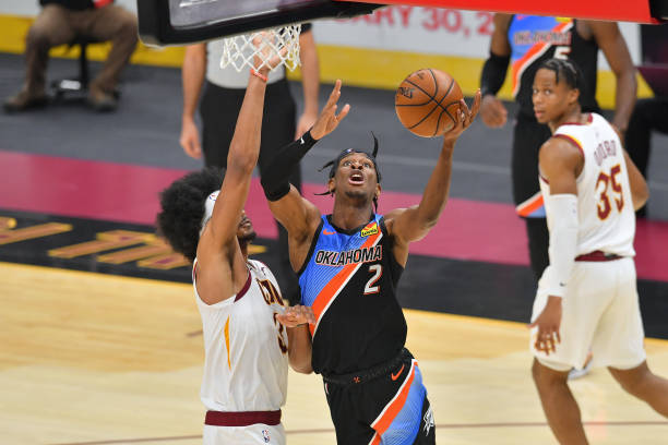 Shai Gilgeous-Alexander of the Oklahoma City Thunder shoots over Jarrett Allen of the Cleveland Cavaliers during the third quarter at Rocket Mortgage...