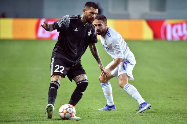 Sheriff's Greek midfielder Dimitrios Kolovos and Real Madrid's Spanish defender Dani Carvajal vie for the ball during the UEFA Champions League...