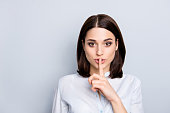 Shh shy sly people person modern concept. Close up portrait of cute lovely attractive uncertain unsure with stylish hairdo entrepreneur making hush gesture isolated on gray background copy-space