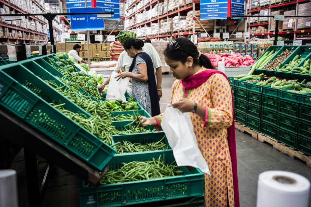 Shoppers select produce in the fruit and vegetable section of a Bharti Walmart Pvt Ltd Best Price Modern Wholesale store in Zirakpur on the outskirts.