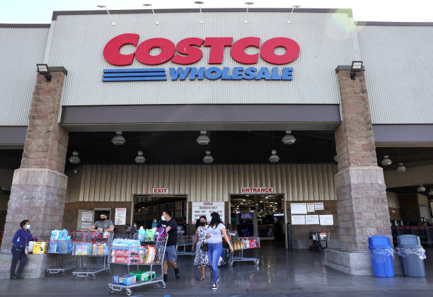 shoppers walk in front of a costco store on february 25 2021 in picture