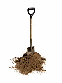 Shovel in heap of dirt
