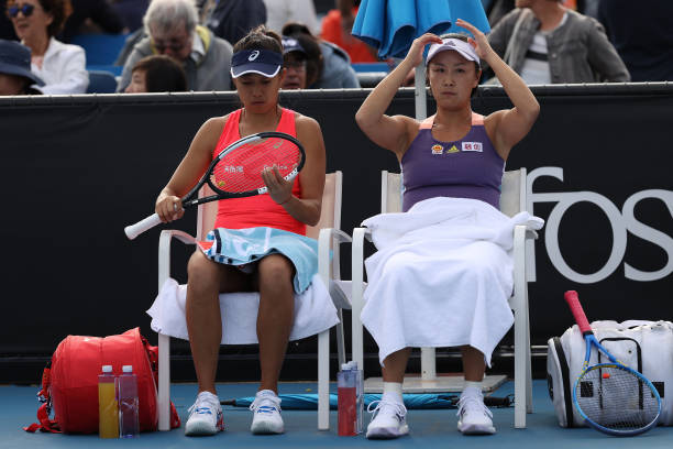 Shuai Peng and Shuai Zhang of China sit down in between games during their Women's Doubles first round match against Veronika Kudermetova of Russia...