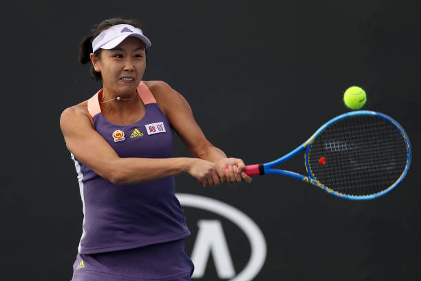 Shuai Peng of China plays a backhand during her Women's Doubles first round match with partner Shuai Zhang of China against Veronika Kudermetova of...