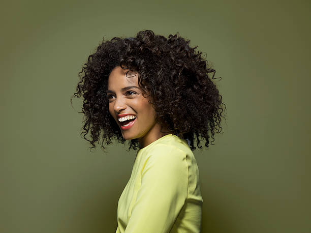 side portrait of a dark skinned female laughing picture