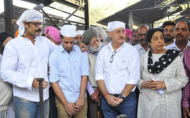 Sikendar Kher Viraj Kher actor Anupam Kher and his wife Chandigarh MP Kirron Kher attending cremation of Thakur Singh father of Kirron Kher at...