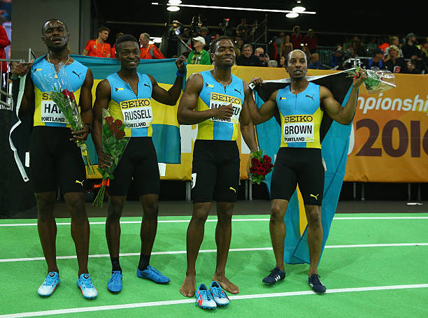 Silver medallists Shavez Hart, Alonzo Russell, Michael Mathieu and Chris Brown of the Bahamas in the Men's 4x400 Metres Relay Final during day four...