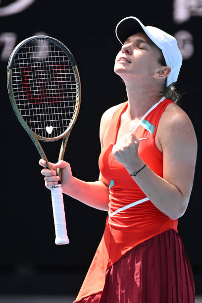 Simona Halep of Romania reacts in her first round singles match against Magdalena Frech of Poland during day two of the 2022 Australian Open at...