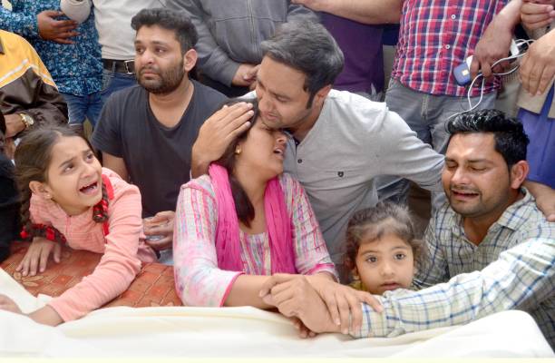 Singer Lakhwinder Wadali showing his grief with his cousins after the death of his uncle Ustad Pyarelal Wadali at his native village Guru Ki Wadali...