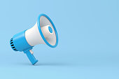 Single blue and white electric megaphone with a handle stands on a blue background