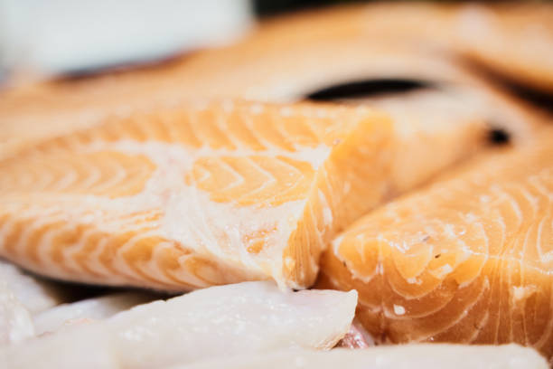 sliced salmon and cod steak on fish display at a fish market picture