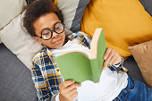 Smart African Boy Reading Book