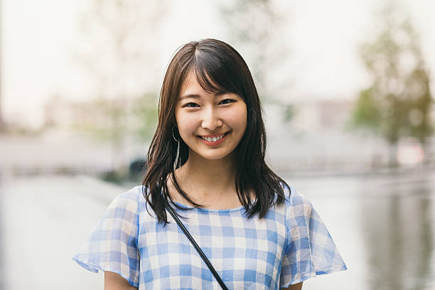 smiling teenage girl - asian woman simple stock pictures, royalty-free photos & images