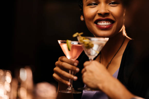 smiling woman enjoying cocktail with male friend at bar picture id1293531343?k=20&m=1293531343&s=612x612&w=0&h=puOlrcjmmB0qtRUx22Rh0DePrCelBdm0woQyCanX Oc=