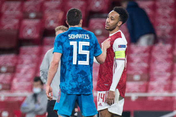Sokratis Papastathopoulos of Olympiacos and Pierre-Emerick Aubameyang of Arsenal during the UEFA Europa League Round of 16 Second Leg match between...