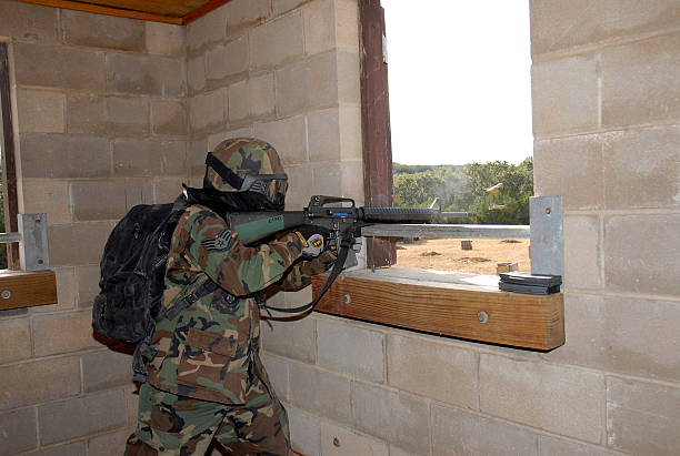 A soldier fires his rifle during training exercises.