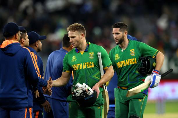 South Africa's Wayne Parnell and David Miller shake hands with team India as they walk back to the pavilion after their victory at the end of the ICC...