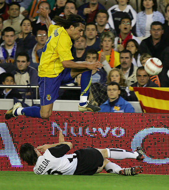 Villarreal's Jose Mari jumps over Valencia's David Albelda during the match against Valencia in the second leg of theUEFA Cup semi-final in Valencia...
