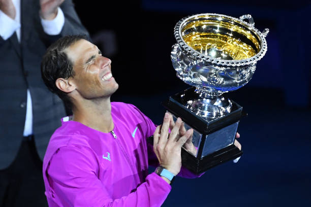 Spain's Rafael Nadal holds the trophy after winning against Russia's Daniil Medvedev in their men's singles final match on day fourteen of the...