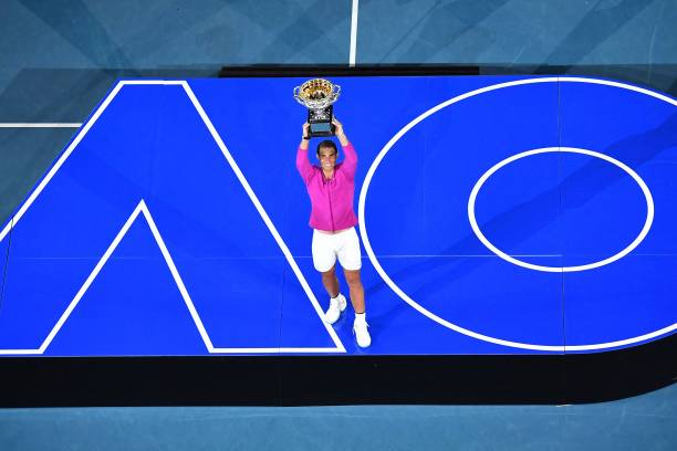 Spain's Rafael Nadal poses with the trophy after winning against Russia's Daniil Medvedev in their men's singles final match on day fourteen of the...
