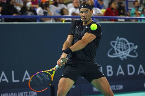 Spain's Rafael Nadal returns the ball to Britain's Andy Murray during their semi-final match of the Mubadala World Tennis Championship in the Gulf...