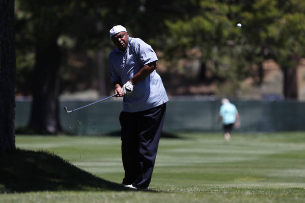 Sports analyst Charles Barkley makes a play on the 18th green during Round Two of the 2022 American Century Championship at Edgewood Tahoe Golf...