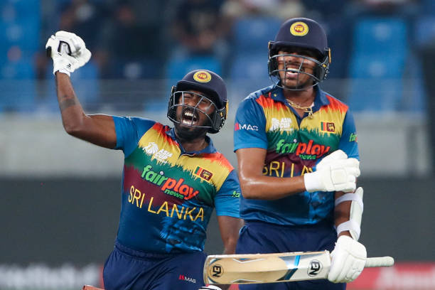 Sri Lanka's Asitha Fernando and Maheesh Theekshana celebrate their win during the Asia Cup Twenty20 international cricket match between Bangladesh...