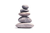 Stack of volcanic pebbles isotaded on white with clipping path