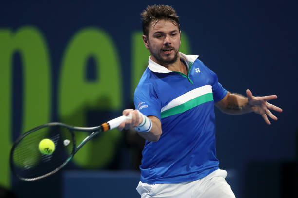 Stan Wawrinka of Switzerland in action during his round one match against Lloyd Harris of South Africa during Day 2 of the Qatar ExxonMobil Open 2021...