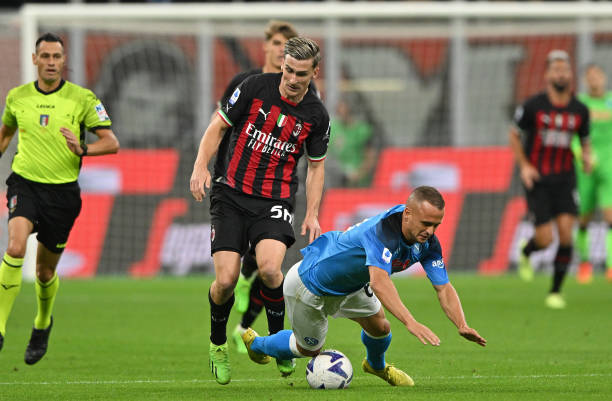 Stanislav Lobotka of SSC Napoli challenged by Alexis Saelemaekers of AC Milan during the Serie A match between AC Milan and SSC Napoli at Stadio...