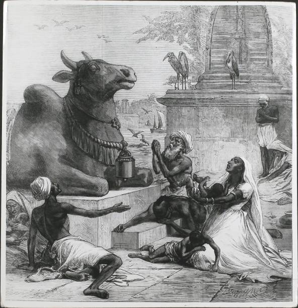 Starving people praying to a cow deity during a famine in India, 1874. From the Illustrated London News - 21st February 1974.