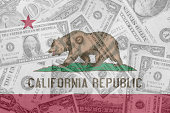 US state of california flag with transparent dollar banknotes