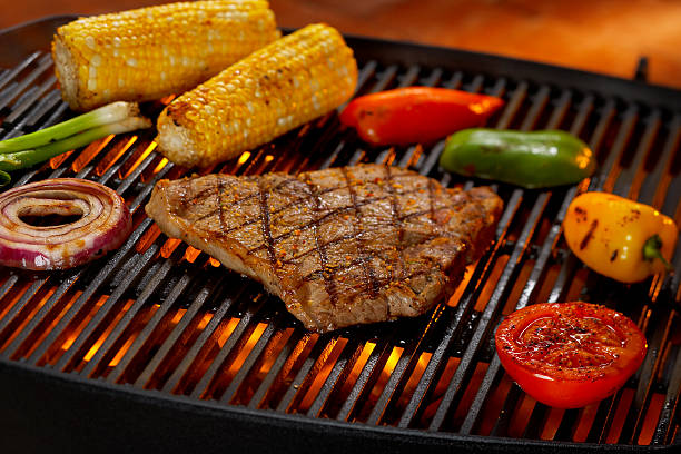 steak and vegetables on grill picture